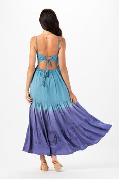 With its floor-grazing length, the Avisa Maxi Dress exudes bohemian elegance, making it perfect for everything from beach weddings to summer soirées. Whether you're dancing under the stars or strolling along the shore, this dress is sure to make you feel like a goddess. Details: 100% Rayon Hand Wash in Cold Water and Lay Flat to Dry Features: Unlined, Smocked Bodice, Self-tie spaghetti strap closure, Tassel tie detail on straps, Open back detail for an adjustable fit, Tiered Maxi Skirt. Measurem Beachy Dresses For Summer Beach Wedding, Beachy Summer Dresses For Beach Wedding, Summer Beach Wedding Dress In Beachy Style, Flowy Breezy Maxi Dress For Beach Wedding, Breezy Flowy Maxi Dress For Beach Wedding, Beachy Tie Back Dresses For Beach Season, Beachy Dress With Tie Back For Beach Season, Flowy Summer Dresses For Beach Wedding, Bohemian Floor-length Maxi Dress With Tie Back