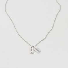 "Dainty Name Tag Necklace with engraved names of your choice. The tag can be personalized with .. - your children or grandchildren name - special date - initials of yourself and a loved one - roman numerals.... the ideas are endless! D E T A I L S - Tag size: 12mm x 7mm/ 0.47\" x 0.27\" - Custom engraved names - Tags can be engraved on one side or both sides --> choose from the drop down menu. - This listing is for ONE necklace. - Each piece or set comes in a gift box, ready for gifting. E N Adjustable Nickel Free Dog Tag Necklace, Personalized Dog Tag Charm Necklaces For Anniversary, Personalized Dog Tag Charm Necklace For Anniversary, Everyday Stamped Dog Tag Necklace, Personalized Adjustable Dog Tag Necklace, Nickel-free Dog Tag Charm Necklace For Gift, Personalized Hand Stamped Dog Tag Jewelry, Adjustable Engraved Charm Necklace Best Friend Gift, Engraved Adjustable Charm Necklace For Best Friend