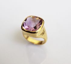 ♦♦ Beautiful handcrafted ring ◘Stone Information: Genuine Amethyst - Color: Purple Cut: Briolette Cushion Size: 15 mm ◘ Metal: 925 Sterling Silver ◘ Band: 4.5 mm textured ◘ Setting: Open back bezel setting ◘ Finish: High polish (shiny) ◘ Nickel free ◘ Anti tarnish ◘ Vermeil Gold ◘ Handmade band: 14 gauge solid sterling wire This ring is adorably rustic, easy to wear, & stackable! ◘Please Note - The Ring in the Picture can be available or Sold out. Every Ring is Made of a Unique Gemstone. The Handmade Fine Jewelry Amethyst Ring For Formal Occasions, Handmade Amethyst Ring For Formal Occasions, Handmade Formal Fine Jewelry Amethyst Ring, Amethyst Ring With Large Stone For Anniversary, Timeless Amethyst Ring As A Gift, Anniversary Ring With Large Amethyst Stone, Timeless Amethyst Gemstone Rings, Handmade Classic Amethyst Ring For Formal Occasions, Elegant Handmade Yellow Gold Amethyst Ring