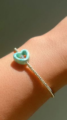 Turquoise Heart  - choose your size  -stretchy bracelet  - This Dainty bracelet is the perfect bracelet to stack with your other bracelets or wear it alone for a minimal look . - handmade with love . Trendy Beaded Bracelets With Heart Charm As Gift, Dainty Open Heart Adjustable Bracelet, Trendy Heart Beads Bracelets As Gift, Nickel Free Turquoise Beaded Bracelets As Gift, Nickel-free Turquoise Beaded Bracelets As Gift, Trendy Heart Beads Bracelet For Gift, Nickel-free Turquoise Beaded Bracelet Gift, Nickel-free Turquoise Beaded Bracelet For Gift, Dainty Adjustable Heart Bangle Bracelet