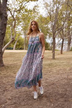 The Betsy Printed Maxi Dress in Teal is a unique and stunning addition to any summer wardrobe. Made from 100% Indian cotton, this dress is designed to be light and flowy, making it perfect for warm weather. The beautiful print adds a touch of bohemian charm, making it a must-have item for the season. With its one size fits all design, this dress is versatile and can fit sizes 2 to 10 comfortably. It is made in India, adding to its authenticity and uniqueness. The teal color adds a pop of color t Casual Flowy Midi Dress For Beach Cover-up, Flowy Casual Midi Dress For Beach Cover-up, Casual Boho Print Sundress As Beach Cover-up, Spring Boho Print Sundress For Beach Cover-up, Flowy Printed Dresses For Beach Cover-up, Casual Multicolor Boho Print Sundress, Sleeveless Boho Print Dress For Beach Cover-up, Flowy Boho Sundress For Beach Cover-up, Summer Boho Dress For Garden Party