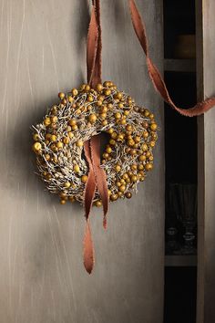 a wreath hanging on the side of a door