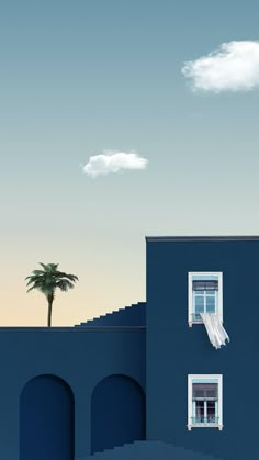 a blue building with two windows and a palm tree in the distance, against a cloudy sky