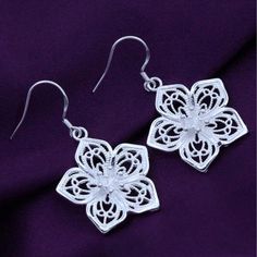 Pretty Flowers Silver Earrings For Women Enchanting Flowers Drop Earrings. Hypoallergenic Stainless Steel With Silver Plating. A Beautiful Pair Of Dangle Filigree, Flower Earrings. 1.5” X .87” Comes On A Black Earring Display Card In A Self-Sealing Plastic Jewelry Sleeve With 2 Extra Silicone Earring Backs. Card Is Approx. 3.5" X 2.5” Packaged With Care Using Reusable Or Recyclable Materials When Available Fast Same Day Or Next Day Shipping From North Carolina Smoke Free Home. Pet Friendly Home Family Dollar, Silver Flower Earrings, Filigree Jewelry, Beaded Jewelry Tutorials, Pop Style, Rings Necklace, Retro Mode, Women Earrings, Silver Jewelry Fashion