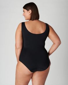 A sleeveless plus size top to transform your workwear and everyday outfits Black Seamless Full Coverage Bodysuit, Black Seamless Shapewear Bodysuit, Supportive Seamless Shapewear Bodysuit, Supportive Full Coverage Smoothing Bodysuit, Supportive Full Coverage Solid Bodysuit, Black Second-skin Bodysuit With Built-in Bra, Compressive Full Coverage Seamless Bodysuit, Compressive Seamless Black Leotard, Compressive Black Seamless Leotard