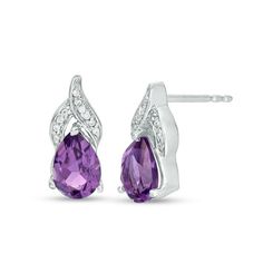 Appeal to her sophisticated taste with these exciting gemstone drop earrings. Created in sterling silver, each graceful earring showcases a 7.0 x 5.0mm pear-shaped bright purple amethyst beneath a flame-inspired design of overlapping ribbons adorned with sparkling diamond accents and beaded detailing. Buffed to a brilliant luster, these post earrings secure comfortably with friction backs. White Gold Teardrop Gemstone Earrings, Formal Teardrop Pendant Gemstone Earrings, White Gold Pear-shaped Gemstone Earrings, Elegant Formal Diamond Earrings With Birthstone, Sterling Silver Pear-shaped Fine Earrings, White Gold Teardrop Gemstone Diamond Earrings, Formal Teardrop Gemstone Diamond Earrings, Sterling Silver Gemstone Teardrop Pendant Earrings, Fine Jewelry Pear-shaped Gemstone Earrings