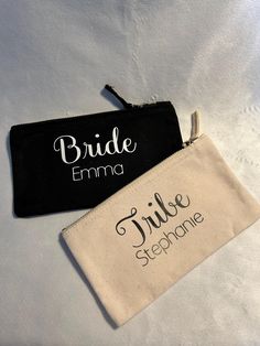 two black and white zippered pouches with the bride and groom names on them