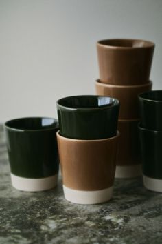 a group of cups sitting on top of a table