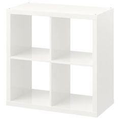 a white shelf unit with four shelves