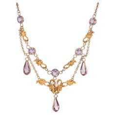 Victorian, 1900's Pearl and amethyst drop necklace. 5 round amethysts with 3 pear shaped amethyst dangles. in 14k yellow gold with one round center pearl. 18.5 inches in length. One 2.7mm natural pearl 5 round Amethyst, approx. total weight 2.40ct 3 pear shaped Amethyst, approx. total weight 4.00ct, 10 x 5mm 14k Yellow Gold Tested: 14k 7.4 grams Cable chain: 1.8mm Length: 18 1/2 inches Pearl And Amethyst, Victorian Pendant Necklace, Art Deco Pendant Necklace, Bijoux Art Nouveau, White Gold Pendant Necklace, Victorian Pendants, Pearl Drop Necklace, Beautiful Fairy, Princess Jewelry