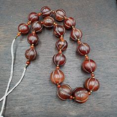 Old Tibetan Carnelian Agate Beads Melon Shape Beaded necklace 20-22mm
This is a handmade beaded necklace made of old Tibetan carnelian agate beads in
melon shape. The beads are red in color and are strung together in a strand
style. The necklace measures 20-22mm in length and is made of agate material. It
was manufactured in India Agate Gemstone Beaded Necklaces With Round Beads, Round Carnelian Beads For Jewelry Making, Agate Beaded Necklaces With Round Beads For Jewelry Making, Agate Gemstone Beaded Necklaces, Carnelian Beaded Necklaces With Gemstone Beads, Traditional Agate Beaded Necklaces With Round Beads, Carnelian Beaded Necklaces With Polished Round Beads, Round Carnelian Beaded Necklaces With Polished Beads, Carnelian Beaded Necklaces With Large Round Beads