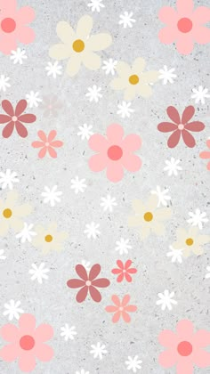 an image of flowers that are on the concrete floor with pink, yellow and white colors