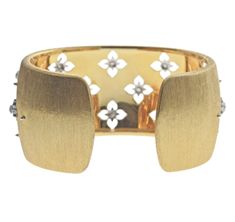 Buccellati two tone gold Macri Giglio 3cm wide cuff bracelet feature 0.75ctw in VS/FG diamonds. Current Retail $38500. DESIGNER: Buccellati MATERIAL: 18k White and Yellow Gold GEMSTONE: Diamond DIMENSIONS: Bracelet is 59mm circumference ( 15cm); Width is 3cm WEIGHT: 63.3 grams MARKED/TESTED: Buccellati italian marks, Au750, W18M1U CONDITION: Previously owned, excellent condition. Designer Yellow Gold Cuff Bracelet, Designer Diamond Cuff Bracelet In Gold, Designer Gold Diamond Cuff Bracelet, Designer Gold Cuff Bracelet With Diamonds, Designer Yellow Gold Cuff Bracelet For Wedding, Diamond Cuff Bracelet, Wide Cuff Bracelets, Gold Bracelet Cuff, Wide Cuff