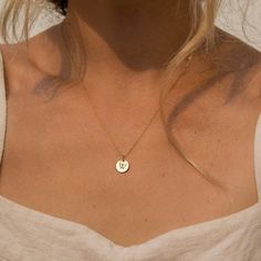 "Our tiny circle initial necklace is a fun choice when you want to make a simple, discreet statement of any single letter, number, or character that you feel defines you the best. Made of 14K gold-filled, the shiny finish disc comes on a dainty and delicate chain, giving you a truly minimalist look. Free Engraving for a limited time! NECKLACE DETAILS ⚬ 14k gold-filled disc(s) and chain. ⚬ Disc measures 10mm (.39\"). ⚬ Chain in your choice of 16\", 18\", or 20\" length ⚬ Personalized engraving of Circle Initial Necklace, Meaningful Necklaces For Girlfriends, Gold J Necklace, Minimalist Initial Pendant Charm Necklace With Birth Flower, Minimalist Birth Flower Charm Necklace With Initial Pendant, Minimalist Birth Flower Initial Pendant Charm Necklace, Minimalist Birth Flower Initial Pendant Necklace, Minimalist Jewelry With Birth Flower Initial Pendant, Minimalist Birth Flower Initial Pendant Jewelry