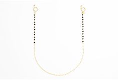 If you're looking for a subtle and classy piece, this chain is the one for you. The elegant gold loops and black spinal stone make for a delicate yet versatile combination. Whether you're going for a casual vibe or a fancy night out, this chain can be styled for any occasion. Gold Glasses, Black Gems, Glasses Chain, Black Spinel, Classic Gold, Delicate Bracelet, Gold Chain, Gold Chains, Are You The One