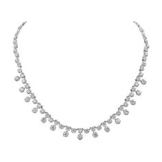 A modern and chic necklace style showcasing round brilliant diamonds weighing 7.81 carats total; Set in a starburst-like setting made in 18 karat white gold. A very brilliant piece of jewelry. 16 inches in length. Diamond Cut Diamond White Platinum Necklace, Diamond Cut Platinum Necklace In Diamond White, Exquisite Diamond Cut Necklace In Diamond White, Brilliant Cut Crystal Diamond Necklace, Platinum Diamond Cut Round Bridal Necklace, Round Platinum Bridal Necklace With Diamond Cut, Dazzling Platinum Necklace With Brilliant Cut, Platinum Bridal Necklace With Diamond Cut, Exquisite Platinum Necklace In Diamond White