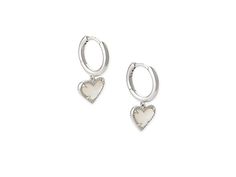 Kendra Scott Ari Heart Huggie Earrings - Earring : Rhodium Ivory Mother-of-Pearl : The Kendra Scott Ari Heart Huggie Earrings are a beautiful hoop with prong-set stone heart pendants. Please refer to color selection for stone detail. 14K gold, 14K rose gold, or rhodium - all plated over brass. Lever back closure. Imported. Measurements: Width: 4 7 in Height: 11 13 in Drop: 2 5 in Weight: 0.1 oz Elegant Double Heart Huggie Earrings With Heart Charm, White Gold Huggie Jewelry For Valentine's Day, Valentine's Day White Gold Huggie Jewelry, Elegant Sterling Silver Heart Huggie Earrings, Elegant Heart-shaped Sterling Silver Huggie Earrings, Silver Huggie Earrings For Valentine's Day Elegant Style, Elegant Sterling Silver Huggie Earrings With Heart Charm, Elegant Silver Huggie Earrings For Valentine's Day, Silver Elegant Huggie Earrings With Heart Charm