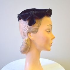 "Vintage 1950s black velvet hat with gimp trim.  Sold at Montaldos.  The hat is in good condition -- no holes or stains; it has a few spots where the nap of the velvet is dented.  The hat has a diameter of 7\". ---> If you need an order shipped by a particular date or shipped via a quicker method, please ask PRIOR to purchase to see if we can accommodate that request. Visit the rest of our shop for more goodies ---> https://www.etsy.com/shop/BlackbirdAntiquesNC Visit our shop policies page for s Vintage Black Costume Hat With Curved Brim, Vintage Black Fascinator, Vintage Black Brimmed Mini Hat, Vintage Black Costume Hats And Headpieces For Church, Vintage Black Mini Hat For Church, Vintage Black Mini Hat For Vintage Events, Black Vintage Fascinator, Velvet Hat, The Velvet