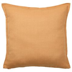 an orange pillow on a white background