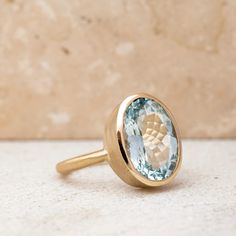 Introducing our exquisite Oval Aquamarine Gold Ring, a stunning piece of jewelry crafted from 14k Yellow Gold and a rare, high-quality aquamarine gemstone. As the birthstone for March, this eco-friendly ring is the perfect gift for any March-born loved one. The oval-shaped aquamarine stone is set in a hand-carved, rich gold setting that accentuates the gemstone's size and clarity. We've opted for a matte finish on the gold setting to allow the stone to shine even brighter. The bezel is heavy-wal Modern Oval Birthstone Ring With Gemstone, Elegant Oval Aquamarine Birthstone Ring, Oval Aquamarine Birthstone Ring, Oval Aquamarine Birthstone Ring Fine Jewelry, Oval Aquamarine Birthstone Ring For Anniversary, Modern Oval Blue Topaz Ring, Oval Blue Topaz Ring With Polished Finish, Oval Aquamarine Anniversary Birthstone Ring, Aquamarine Birthstone Ring, Oval