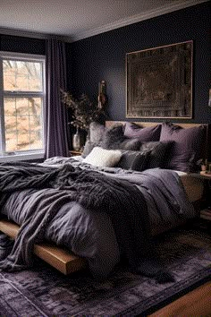 a large bed sitting in a bedroom next to a window with purple curtains on it