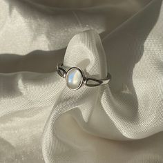 Adjustable to fit all ring sizes Classic Opal Moonstone Ring As Gift, Classic White Gold Cabochon Jewelry, Spiritual Adjustable Jewelry With Round Stone, Elegant Adjustable Birthstone Ring For Gift, Timeless Adjustable Oval Rings, Minimalist Oval Cabochon Wedding Jewelry, Delicate Gemstone Open Ring Jewelry, Minimalist Cabochon Jewelry For Formal Occasions, Elegant Adjustable Metal Ring