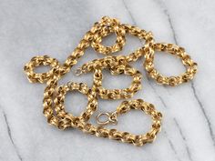 Dating to the late 1800s or early 1900s, this antique chain is detailed with formed, ribbon-like links. The craftsmanship is superb, each link forming a tiny work of art. The style is very gothic and would be suitable for a man or a woman, perfect alone or worn with a pendant. Metal: 14K Yellow GoldWidth of Chain: 5.0 mmLength of Chain: 24 InchesMarks: "14KT" Stamped on the clasp Necklace Antique, Link Chain Necklace, Chain Link Necklace, Early 1900s, Estate Jewelry, Link Chain, Antique Gold, Chains Necklace, Gold Chain