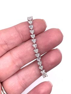 Elevate your wrist game with our exquisite 6 CTW Heart Lab-Grown Diamond Bracelet in 14K White Gold. Featuring stunning VS clarity, F color diamonds, this piece exudes elegance and sophistication. Perfect for adding a touch of luxury to any outfit, it's a statement piece you'll cherish forever. Treat yourself or a loved one to this sparkling beauty today! Customization is our specialty! As direct gemstone and diamond brokers, along with being jewelry designers, we're thrilled to offer personaliz Heart Shaped Diamond Bracelet With Accents, Diamond Heart Bracelet With Accents, Diamond Heart Bracelet With Diamond Accents, Classic Diamond Heart Bracelet, White Gold Diamond Heart Bracelet For Wedding, White Gold Diamond Heart Bracelet For Anniversary, Classic Round Diamond Heart Bracelet, Classic Diamond Bracelets For Valentine's Day, Elegant Diamond Heart Bracelet With Brilliant Cut