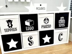 a toy storage unit with black and white decals on the sides, including stars