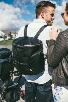 Who says men can't carry diaper bags? Super stylish backpacks for the modern family. Modern Black Shoulder Bag For Weekend Trips, Black Diaper Bag With Removable Pouch For On-the-go, Functional Leather Diaper Bag With Removable Pouch, Large Capacity Black Diaper Bag For On-the-go, Functional Leather Diaper Bag, Functional Diaper Bag With Zipper Pocket For Weekend Trips, Black Diaper Bag For Travel, Black Satchel With Zipper Pocket For On-the-go, Practical Black Travel Bag With Zipper Pocket