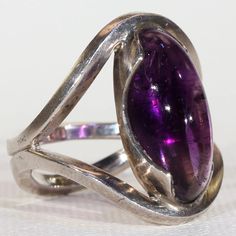 Formal Cabochon Round Gemstone, Formal Amethyst Jewelry With Polished Finish, Modern Jewelry With Oval Cabochon Bezel Setting, Modern Oval Jewelry With Polished Edges, Modern Jewelry With Bezel Set Oval Cabochon, Elegant Amethyst Cabochon Ring, Modernist Formal Cabochon Rings, Fine Jewelry Silver Cabochons For Formal Occasions, Formal Cabochon Amethyst Ring Fine Jewelry