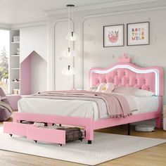 This playful platform storage bed in a bright pink color adds a pop of fun to your child's bedroom. Crafted from a combination of solid and engineered wood, it's fully upholstered in PU faux leather with a bright pink hue. The tufted arched headboard features a crown accent and adjustable height, reaching up to 52". Plus, it has a lighted feature for added flair. With built-in drawers for extra storage, this bed eliminates the need for a box spring. It's available in twin, full, and queen sizes, Crown Headboard, Storage Stools, Kids Platform Bed, Button Headboard, Bedroom Tidy, Bed Frame Double, Leather Platform Bed, Cartoon Ears, Shaped Headboard