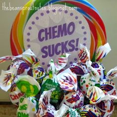 there is a candy bouquet in front of a sign that says chemo sucks on it