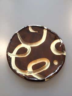 a brown and white plate sitting on top of a table