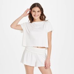 Get ready for bed in charming style with this Short-Sleeve Top and Shorts Pajama Set from Colsie™. This two-piece pull-on pajama set includes a short-sleeve top and pajama shorts, both featuring allover lettuce trim for pretty flair. The pajama set is crafted from soft, stretchy fabric to keep you moving through the day in absolute comfort, while a full elastic waistband on the shorts provides a snug fit. You can wear the pieces together or mix and match with other sleepwear for a variety of com Casual Short Sleeve Sleep Tops, Short Cotton Tops For Loungewear, Cotton Lounge Tops With Short Sleeves, Cotton Tops For Loungewear, Cotton Short Tops For Loungewear, Cotton Loungewear Tops With Short Sleeves, Relaxed Fit Short Set For Spring Loungewear, Comfortable Short Sleep Tops, Summer Relaxed Fit T-shirt For Lounging