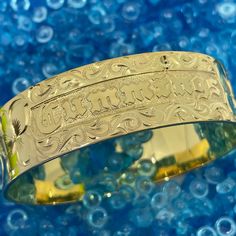 Locally Handmade. Please Allow 3-5 weeks for delivery. You will love and cherish these Custom Hawaiian Scroll Bangles. The Hawaiian Scroll Design is hand engraved by a local Master Engraver. Free Engraved Name in Black Enamel or Raised Gold lettering is included! It is beautiful, one-of-a-kind and custom made especially for YOU!! Our customers tell us these look just like the solid gold pieces they have - but we've made them affordable with 14K Gold Plating over .925 Sterling Silver. 6mm ~ $249 Traditional Gold Stamped Bracelet, Ceremonial Adjustable Engraved Bangle, Engraved Adjustable Bangle Name Bracelet, Engraved Bangle Bracelet For Personalized Gift, Engraved Name Bangle Bracelet For Anniversary, Adjustable Etched Bracelets For Anniversary, Engraved Name Bangle For Anniversary, Adjustable Engraved Bangle For Personalized Gift, Gold Bangle With Engraved Text