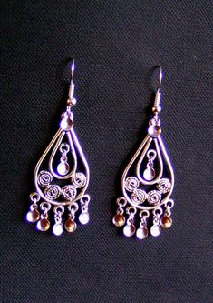 "KARIN - Beautiful hand crafted Traditional Antique Silver Plated Filigree Teardrop Norwegian Solje Style earrings made of silver plated wire, silver plated drops and lovely .925 Sterling Silver or Silver plated earwires or posts Ear Wire Earrings: Earrings measure 2.25 inches long and .75 inches wide on either .925 Sterling Silver or Silver plated ear wires. Post Earrings: Earrings measure 1.75\" long and .75 inches wide on either .925 Sterling Silver or Silver Plated posts All soljes use a var Traditional Nickel-free Sterling Silver Teardrop Earrings, Traditional Silver Drop Jewelry, Ornate Sterling Silver Teardrop Filigree Earrings, Handmade Ornate Teardrop Earrings, Traditional Handmade Silver Teardrop Earrings, Handmade Traditional Silver Teardrop Earrings, Traditional Teardrop Earrings As A Gift, Traditional Teardrop Earrings For Gift, Ornate Handmade Silver Teardrop Earrings