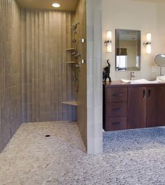 a large bathroom with two sinks and mirrors