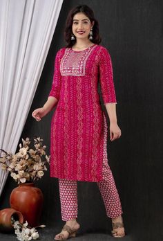 Summer collection kurti pant suit. 3 piece set . Fabric : Reyon fabric kurti , georgette Dupatta with Zari lining, rayon pants. Work : Printed base , border work with Zari lace. Sequence work . Measurement : Kurti length 44in , pant 38 length, Dupatta 2.10 meters, Pink Pant Set With Straight Kurta, Pink Palazzo Set With Printed Motifs, Pink Pant Set With Dabka Work For Diwali, Pink Resham Embroidery Pant Set For Diwali, Pink Pant Set With Resham Embroidery For Diwali, Bollywood Style Pink Pant Set With Dabka Work, Pink Cotton Kurta With Bandhani Print, Pink Bandhani Print Palazzo Set With Straight Kurta, Pink Palazzo Set With Bandhani Print And Straight Kurta