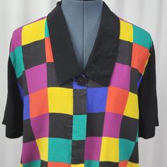 Spice up your wardrobe with this vintage Bedford Fair multicolored block blouse! Perfect for a rockabilly look, this rayon blouse in size 10 is a stylish addition to any outfit. Don't miss out on this 1990s treasure! #vintagefashion #bedfordfair #multicolorblouse #rockabillystyle #90sfashion 🌸💃🏻👚 Multicolor Short Sleeve Tops With Colorful Pattern, Multicolor Short Sleeve Top With Colorful Pattern, Trendy Short Sleeve Blouse With Colorful Pattern, Multicolor Collared Top For Fall, Retro Colorful Pattern Blouse For Summer, Retro Summer Blouse With Colorful Pattern, Multicolor Collared Blouse For Work, Multicolor Collared Blouse For Workwear, Retro Blouse With Colorful Pattern For Summer