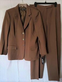 KASPER 14 Dark Camel Brown 2-Pc Blazer & Lined Pants Suit NWT $280 X X Click to Enlarge Click to Enlarge Kasper makes a classic suit and this one is timeless. From the Indian Summer collection, it is well made and can be worn year-round. 64% Polyester, 32% Viscose, 4% Spandex 100% Polyester lining Dry clean 3 button front closure on jacket Notched collar Padded shoulders Bust 44" Length of jacket center back to hem 27" Pants have front fly with flat hook/eye closure and inside button Unopened side hip welt pockets Inseam 31.5" NWT, new with tags MSRP $280.00 You don't have to spend hundreds of dollars for name brand clothing. I have some wonderful clothing that is new and in perfect condition (unless otherwise noted) that I'm offering at considerable discounts off department store retail. Lined Pants, Classic Suit, Pants Suit, Pant Suit, Indian Summer, Brown Pants, Brand Clothing, Suit Separates, Hook Eye