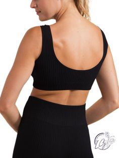 This seamless sports bra sits just on top of the rib cage. It features a seamless construction, an all-over ribbed texture, and a round scoop neckline on both the front and the back. Fabric: 92% Nylon & 8% Spandex. Seamless technology. Moisture-wicking. Four-way stretch. Sporty Ribbed Scoop Neck Sports Bra, Sports Ribbed Scoop Neck Sports Bra, Ribbed Scoop Neck Sports Bra In Athleisure Style, Ribbed Seamless Sports Bra For Yoga, Ribbed Seamless Sports Bra For Sports, Ribbed Seamless Sports Bra, Athleisure Ribbed Scoop Neck Sports Bra, Seamless Ribbed Sports Bra, Ribbed Scoop Neck Crop Top For Yoga