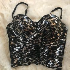 New Beautiful Marciano Silver/Black Sequin Bustier, Not Itchy Or Scratchy On Skin. Purchased At Marciano Store. Quality Sequin, Feels Like Metal Sequin Not Plastic. Smoke Free Home *I Have Other Marciano Listings Serious Buyers, No Holds Or Trades. Thank You For Browsing My Closet 10% Off When You Buy 2 Or More Items From My Closet Metallic Fitted Tank Top For Night Out, Glamorous Fitted Metallic Tank Top, Silver Fitted Tank Top For Party Season, Fitted Shimmer Tank Top For Night Out, Fitted Shimmer Tank Top For Party, Silver Fitted Tank Top For Party, Fitted Silver Tops For The Club, Elegant Metallic Tank Top For Party, Glamorous Silver Tank Top For Party