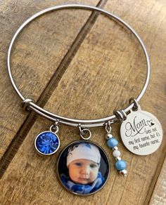 "Mom bracelets feature your favorite photo, Mom saying engraved in stainless steel, matching beads, and your choice of rhinestone color. Options to add more photos and rhinestones are available at checkout. These make great gifts!! INCLUDES: - Photo Charm - Saying as shown - Rhinestone (your choice of color) - Matching Beads Bracelets are made of stainless steel and come in 3 sizes: - Large 2.6\" (larger wrists/hands) - Average 2.4\" (fits most) - Child 2.0\" (elementary school age or tiny wrist Hypoallergenic Stainless Steel Jewelry For Memorial, Stainless Steel Bangle Beaded Bracelets For Gift, Stainless Steel Beaded Bangle Bracelets As Gift, Personalized Hypoallergenic Stainless Steel Jewelry, Hypoallergenic Stainless Steel Jewelry For Personalized Gifts, Personalized Adjustable Jewelry Keepsake, Personalized Adjustable Keepsake Jewelry, Personalized Metal Jewelry For Memorial, Personalized Stainless Steel Jewelry For Memorial