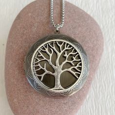 "The tree of life symbolizes life and the interconnections of the universe to sustain life. Timeless and classic, this gorgeous antiqued silver locket will become a special addition to your jewelry collection. This locket is extra large at 46mm in diameter, silver plated brass and opens for a secret place to keep pictures, messages, or whatever you like. The interior of the locket where a photo fits is 30mm. It can fit two photos. This locket is embossed on both sides and is lightweight and comf Symbolic Tree Of Life Round Pendant Jewelry, Symbolic Silver Tree Of Life Jewelry, Symbolic Silver Jewelry With Tree Of Life, Tree Of Life Round Pendant Jewelry Gift, Spiritual Tree Of Life Jewelry Gift, Spiritual Tree Of Life Jewelry As A Gift, Spiritual Tree Of Life Jewelry For Gifts, Bohemian Silver Jewelry With Tree Of Life, Tree Of Life Jewelry Gift