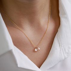 "A delicate rock crystal necklace is made to highlight Your Beauty. High-quality, flawless clear crystal quartz is neatly centered on the classic yet strong chain in the metal type and the length of your choice. Great as a gift for your beloved one on an April birthday or 10th Anniversary for your wife. Matching earrings: https://etsy.me/2lBd83i MATERIALS: * natural rock crystal (clear quartz) * tiny rondelles at the chain ends (except 14k Gold) * available 14k Gold Filled, Sterling Silver, 14k Rose Gold Crystal Necklace With Delicate Chain, Rose Gold Delicate Chain Crystal Necklace, Elegant Rose Gold Crystal Necklace With Delicate Chain, Elegant Rose Gold Crystal Necklaces With Adjustable Chain, Elegant Rose Gold Crystal Necklace With Adjustable Chain, Elegant Rose Gold Crystal Necklace With Round Pendant, Dainty Faceted Necklaces, Elegant Rose Quartz Round Crystal Necklaces, Elegant Rose Quartz Round Crystal Necklace