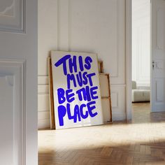 this must be the place sign in an empty room