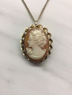 12k Shell cameo and chain made around 1920 in great condition. Classic Cameo Necklace With Oval Pendant, Elegant Cameo Necklace For Formal Occasions, Elegant Cameo Medallion Necklace, Elegant Vintage Camo Jewelry, Vintage Oval Cameo Necklace, Elegant Cameo Pendant Necklace, Antique Formal Necklace With Oval Pendant, Antique Oval Pendant Necklace For Formal Occasions, Vintage Cameo Medallion Necklace