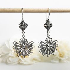 925 Sterling Silver Handmade Artisan Crafted Filigree Dangle Drop Earrings Material: 925 Solid Sterling Silver Earrings Length: 2.25 inches Width: 1 inch Finishing: Oxidized and Polished Comes with a gift pouch and box Free Domestic Shipping We hope that you enjoy our exclusive artisan handcrafted jewelry. Silver Chandelier Earrings With Intricate Design For Formal, Elegant Oxidized Chandelier Earrings For Weddings, Sterling Silver Chandelier Earrings As Gift, Filigree Chandelier Earrings As Gift, Antique Silver Nickel-free Earrings For Wedding, Nickel-free Antique Silver Earrings For Wedding, Ornate Sterling Silver Chandelier Earrings, Nickel Free Antique Silver Wedding Earrings, Ornate Sterling Silver Chandelier Earrings For Formal Occasions