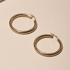 Medium Hollow Hoop Earrings Classic Small Hoop Earrings In 14k Gold Filled, Timeless Small Hoop Gold-plated Earrings, Timeless Small Hoop Gold Plated Earrings, Small Hoop 14k White Gold Jewelry, Minimalist 14k Gold Hoop Earrings With Shiny Finish, Classic 14k Gold Filled Hoop Earrings For Anniversary, Classic 14k Gold Hoop Earrings For Everyday, Timeless Rose Gold Hoop Earrings For Everyday, Timeless Sterling Silver Jewelry